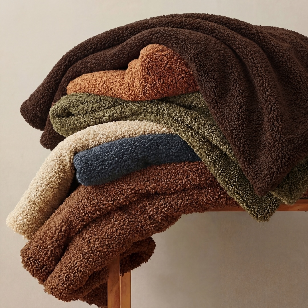 Inspired by classic boucle softness and cozy evenings at home, wraps every space in rich texture and everyday luxury, perfect for draping over sofas, chairs, or beds.