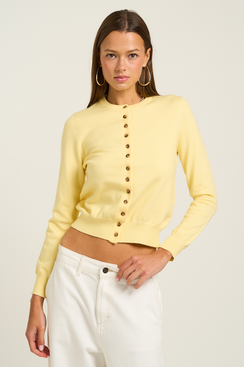 This lightweight knit button-up top comes in the prettiest pastel colors, perfect to pair with any kind of bottoms. The top screams Spring and preppy. K1225
