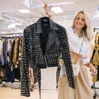 Apparel & Accessories buyer holding a studded leather jacket